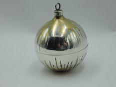 A Stuart Devlin 1982 silver Christmas tree bauble having gilt decoration and lift off cover