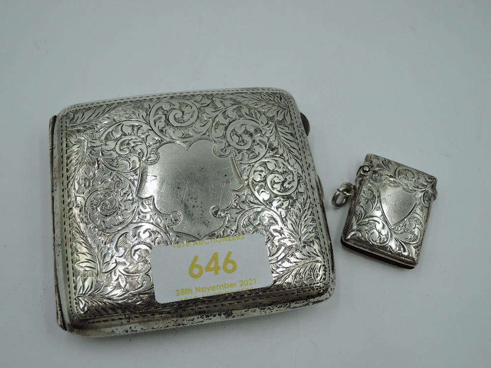 A silver cigarette case having engraved scroll decoration and plain cartouche, Birmingham 1916, John