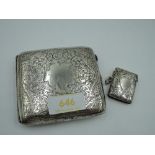 A silver cigarette case having engraved scroll decoration and plain cartouche, Birmingham 1916, John