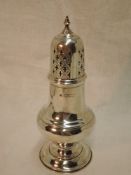 A Victorian silver sugar caster of waisted baluster form having gilt interior and pierced push on