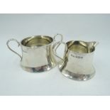 A silver cream jug and sugar bowl of small plain tapered circular form, Sheffield 1921, Walker &