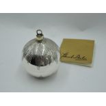 A Stuart Devlin 1983 silver Christmas tree bauble having etched decoration and lift off cover