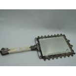 A Victorian hand mirror having ivory handle with silver collar and knop and plated framed mirror