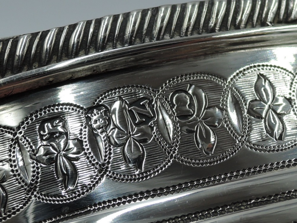 A large Georgian silver sugar bowl of oval form having engraved decoration, gadrooned rim and - Image 2 of 2
