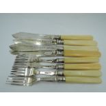 An Edwardian four place setting of fish knives and forks having bone handles and silver blades,