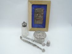 A small selection of HM silver including framed book cover having cherub decoration, glass