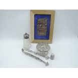 A small selection of HM silver including framed book cover having cherub decoration, glass