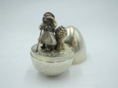 A Stuart Devlin Limited Edition silver gilt surprise egg, no 70, having textured shell opening to