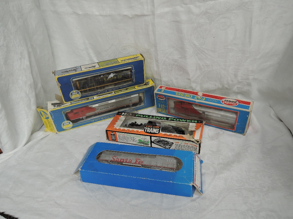 Two AHM HO scale Santa Fe Locomotives 2099 and 1456, both boxed, a Model Power HO scale Santa Fe FA2