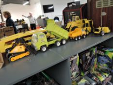 A collection of Tonka pressed steel Toys including Car Carrier with two cars, Mighty Loader,
