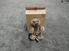 A modern Steiff Bear, Classic Teddybear 26 having yellow tag 030499, height 25cm and boxed with