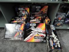 A shelf of modern Kenner Star Wars accessories, Imperial AT-ST, X-Wing Fighter, Detention Block
