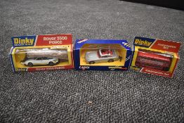 A Corgi diecast James Bond Aston Martin in silver with red interior with driver bandit and spare