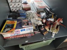 A shelf of Star Wars Toys and games including Top Trumps, Micro Machines, Data File, Puzzle Pack,