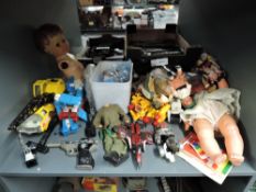 A collection of mixed toys including Tonka Crane, Transformers, Britains Space Cannon, Britains Sta