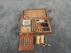 A late 19th century Games Compendium in fitted wooden case containing two sets of James English