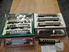 Seven Hornby 00 gauge Pullman and similar Carriages, part boxed along with a Mainline 00 gauge 4-6-0