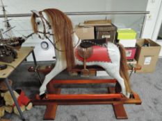 A modern Rocking Horse hand made by S K Backhouse number 302 having horse hair mane and tail with