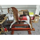 A modern Rocking Horse hand made by S K Backhouse number 302 having horse hair mane and tail with