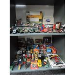 Two shelves of mixed vintage diecasts, mainly Land Rover related including Burago, Corgi,