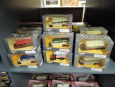 Twenty-Two Corgi Classics diecast Vans and Buses, all boxed