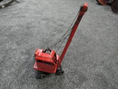 A Triang tin plate Jones KL44 Crane in red with black chassis and wheels