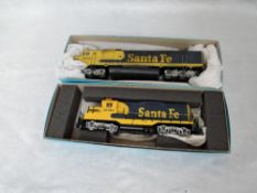 Two Walther and similar HO scale Santa Fe Locomotives 2050 & 5991, both in Athearn boxes