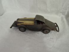 A shelf of vintage toys and games including possible WW2 hand made model car, Cricketome, The