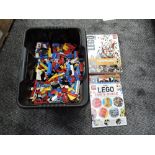 A box of vintage Lego pieces along with The Lego Book including Standing Small and The Lego Fans