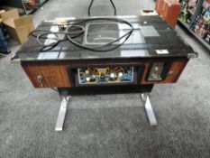 A Taito electric Space Invaders coffee table top arcade game for two players, on chrome legs