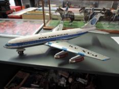 A 1960's Japanese Nomura Toys tin plate and battery operated model, Pan Am Jet Clipper American