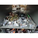 A shelf of modern Kenner and Hasbro Star Wars figures and accessories