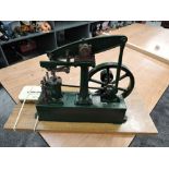 A Stuart Turner Live Steam Beam Engine having spoked flywheel, numbered 80063, on wooden base,