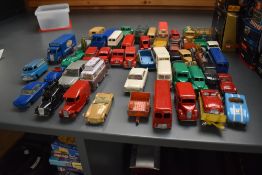 A collection of Dinky, Corgi, Spot-On and similar playworn diecasts including Dinky Ever Ready and