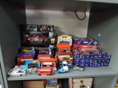 A shelf of 1980's and later diecasts including Corgi in blue and red boxes, Days Gone, Exchange
