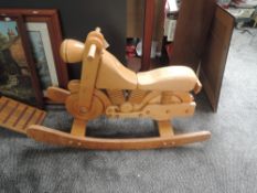 A child's modern wooden model Motorbike on rocking base, length 100cm, height 60cm