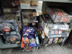 A shelf of Micro Machines Star Wars Accessories including Millennium Falcon, The Death Star, Darth