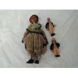 A vintage wooden hand made Witch Doll, length 23cm along with two HCF Germany celluloid miniature