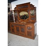 A Victorian mahogany mirror back sideboard having carved detail to drawers and doors, width approx