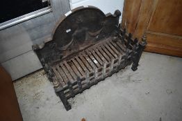 A traditional cast iron dog grate