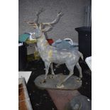 A cast alloy deer, standing