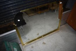 A vintage brass part framed mirror , width approx 95cm
