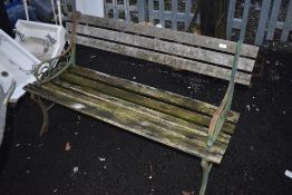A garden bench having metal ends and wood slats
