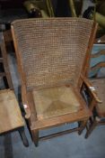 An Orkney style armchair with traditional basket work and strung seat