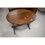 A vintage oak oval occasional table, width approx. 66cm