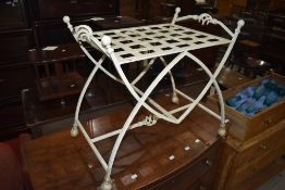 A metal work luggage rack or tray stand
