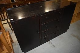 A vintage dark stained breakfront sideboard, width approx. 137cm