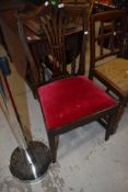 A 19th Century stained frame formal dining chair having red dralon drop in seat