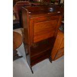 A Victorian mahogany writing bureau of shallow form with two bookshelves under, includes key,