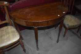 A reproduction Regency style demi lune hall table, fold over top with fitted interior, width approx.
